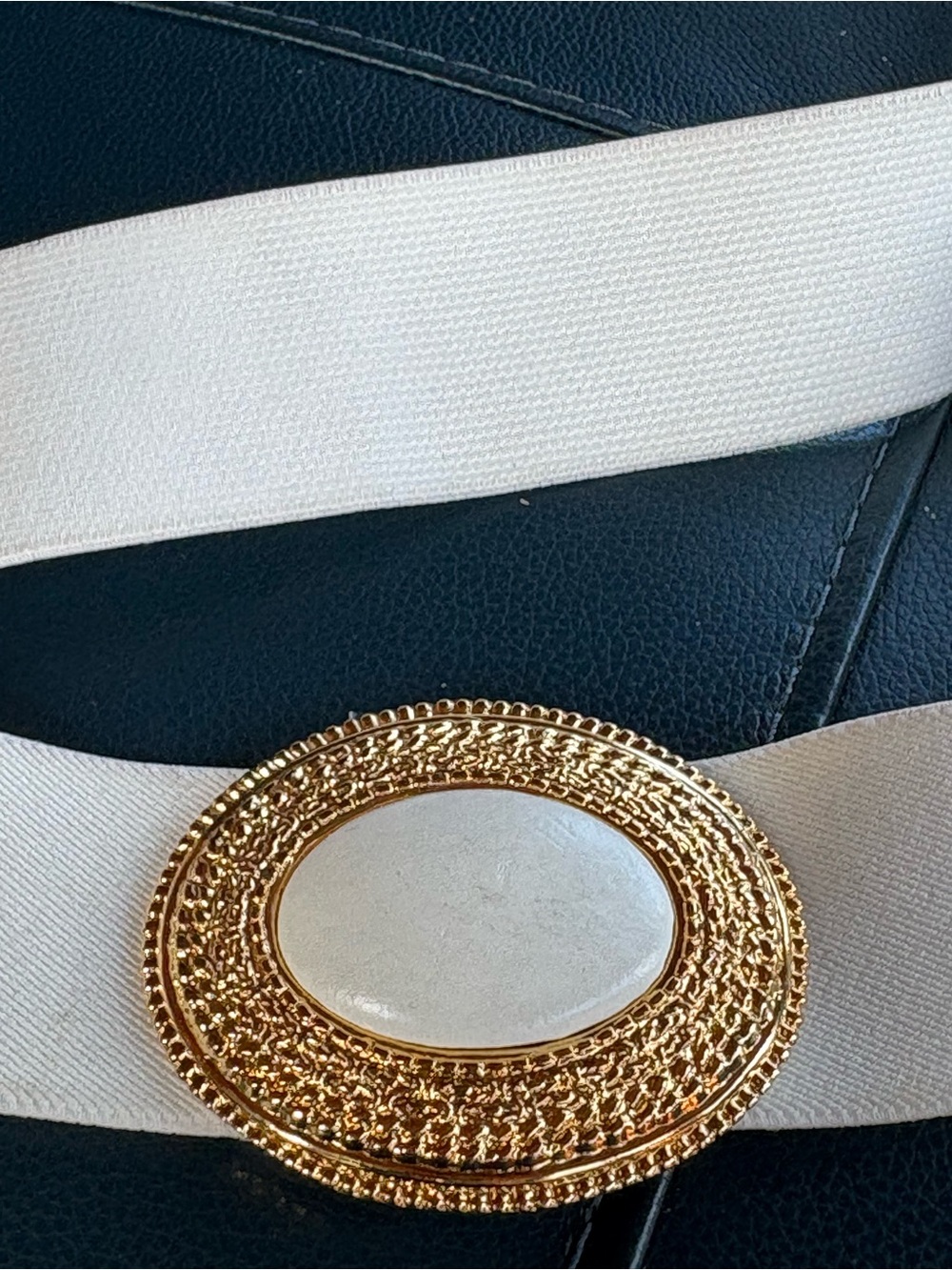 Ecru Vintage Day Lor stretchy belt with gold and marble-like 80’s belt.